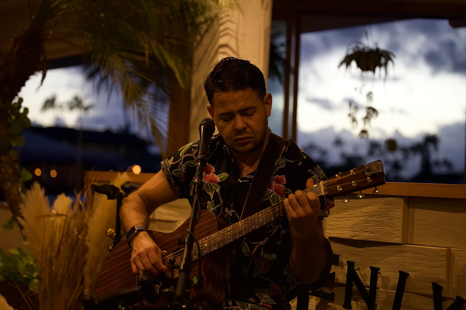 Billy Sage 5 singing at dusk during a live set at Heavenly Island Lifestyle